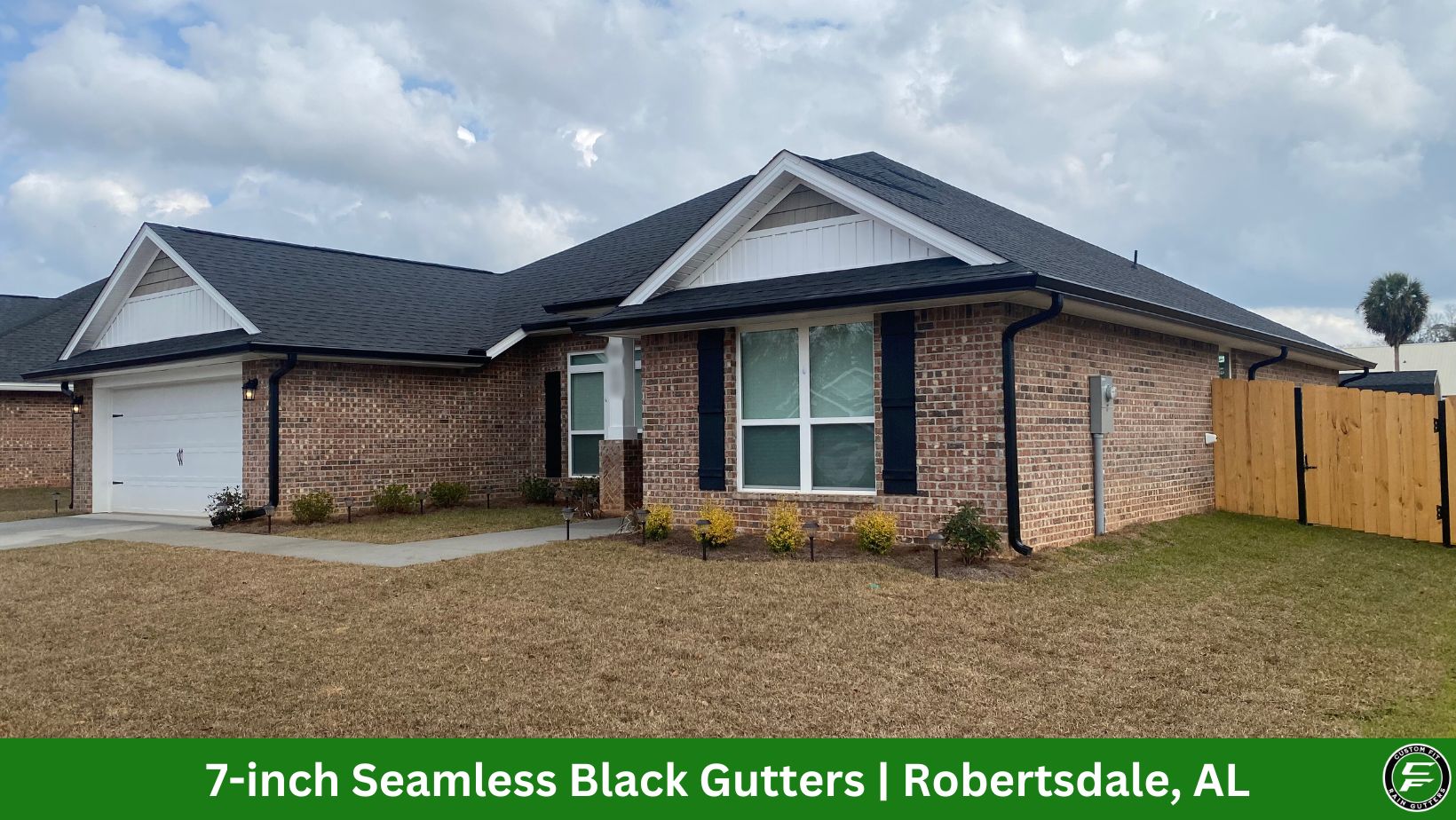 7-inch black seamless gutters installed on a home in Robertsdale, AL.